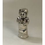 An unusual novelty silver pepper in the form of a