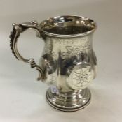 A Victorian chased silver christening mug. Birming