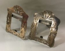 A pair of Continental silver frames with floral de