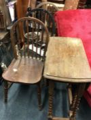 Three stick back chairs together with a drop leaf