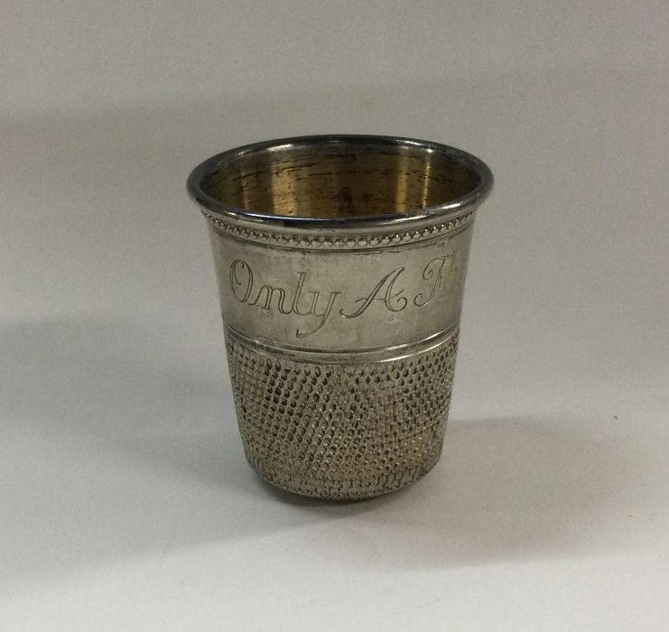 A large novelty silver beaker in the form of a thi