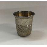 A large novelty silver beaker in the form of a thi