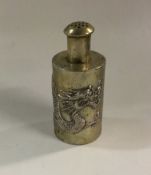 A Chinese silver pepper with chased dragon decorat