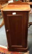 A mahogany pot cupboard.