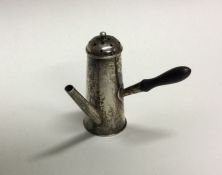 A novelty silver pepper in the form of a miniature
