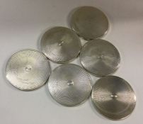 A set of six silver coasters bearing import marks.
