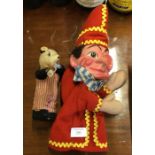 A small child's toy together with a "Mr Punch".