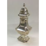 A large silver shaped sugar caster. London. Approx
