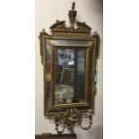 An Antique gilt framed mirror.