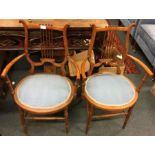 A pair of Victorian satinwood chairs.