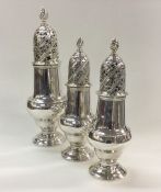 A rare set of three good George III silver sugar c