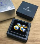 A fine pair of cased silver and enamel cufflinks.