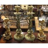 Two good pairs of brass candlesticks.