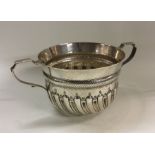 A heavy Victorian silver fluted porringer of 17th