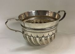 A heavy Victorian silver fluted porringer of 17th