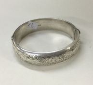 A heavy silver engraved bracelet with concealed cl