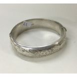 A heavy silver engraved bracelet with concealed cl