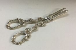 A heavy pair of silver grape scissors. London. App