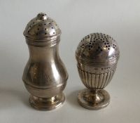 Two silver peppers of baluster form. Various dates