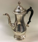 A heavy George III silver coffee pot. London 1768.