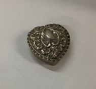 A Victorian silver heart shaped box. Approx. 9 gra