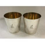 A fine pair of stacking silver beakers inscribed w