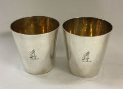 A fine pair of stacking silver beakers inscribed w