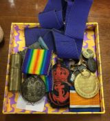 A pair of war medals together with badges etc.