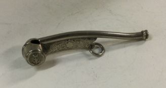 A silver plated bosun's whistle. Est. £30 - £40.