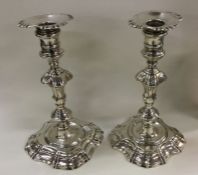 A pair of George II cast silver candlesticks. Lond