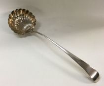 A heavy George III silver soup ladle. London 1826.