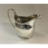 A George III bright cut silver cream jug. London 1
