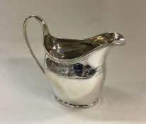 A George III bright cut silver cream jug. London 1