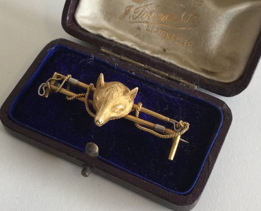 A fine quality 18 carat gold double crop brooch wi