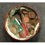 A large tin of copper and other coinage.