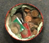 A large tin of copper and other coinage.