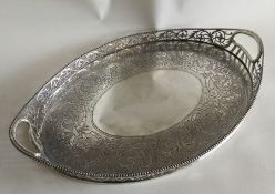An Edwardian silver circular gallery tray with pie