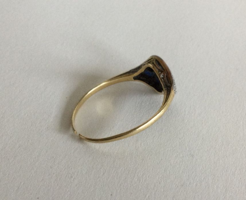 A stylish sapphire and diamond ring with large cen - Image 2 of 2