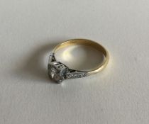 A good diamond single stone ring in two colour gol