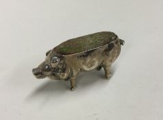 A novelty silver pin cushion in the form of a pig