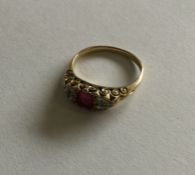 A good ruby and diamond cluster ring in 18 carat g