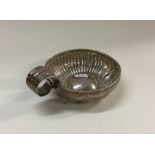 An Antique French silver wine taster with chased d