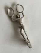 An unusual paid of sugar scissors in the form of a