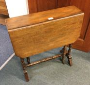 A mahogany drop leaf table.