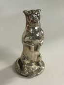 An unusual silver pepper in the form of a dog in s