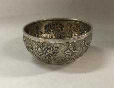 An Asian silver bowl with chased decoration depict