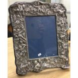 A large and heavy chased silver picture frame deco