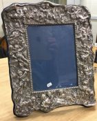 A large and heavy chased silver picture frame deco