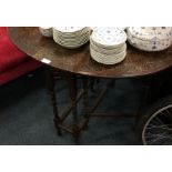 An oak carved drop leaf table.