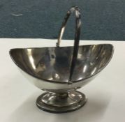 A Georgian silver swing handled basket. London 180